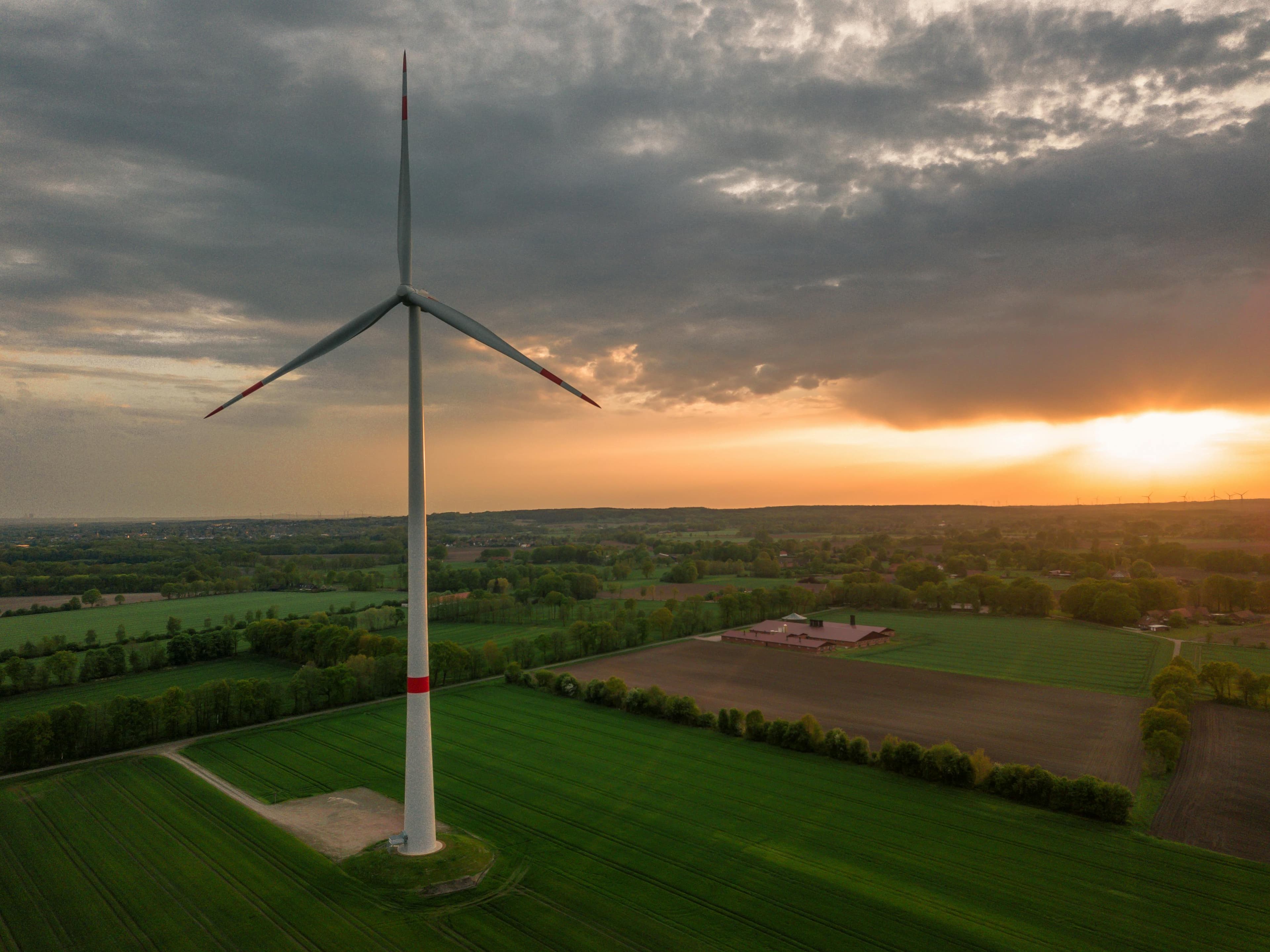 Aerial view of wind turbine at sunset